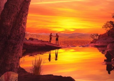 Two hikers share a sunset in Australia