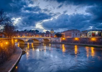 A night panorama of a bridge crossing a river in Florence, Italy