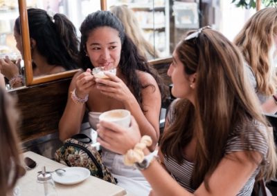 Students enjoying coffee in an Italian coffee shop