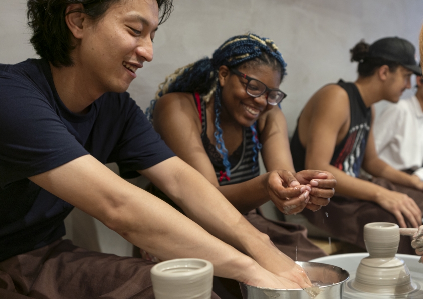 students making pottery